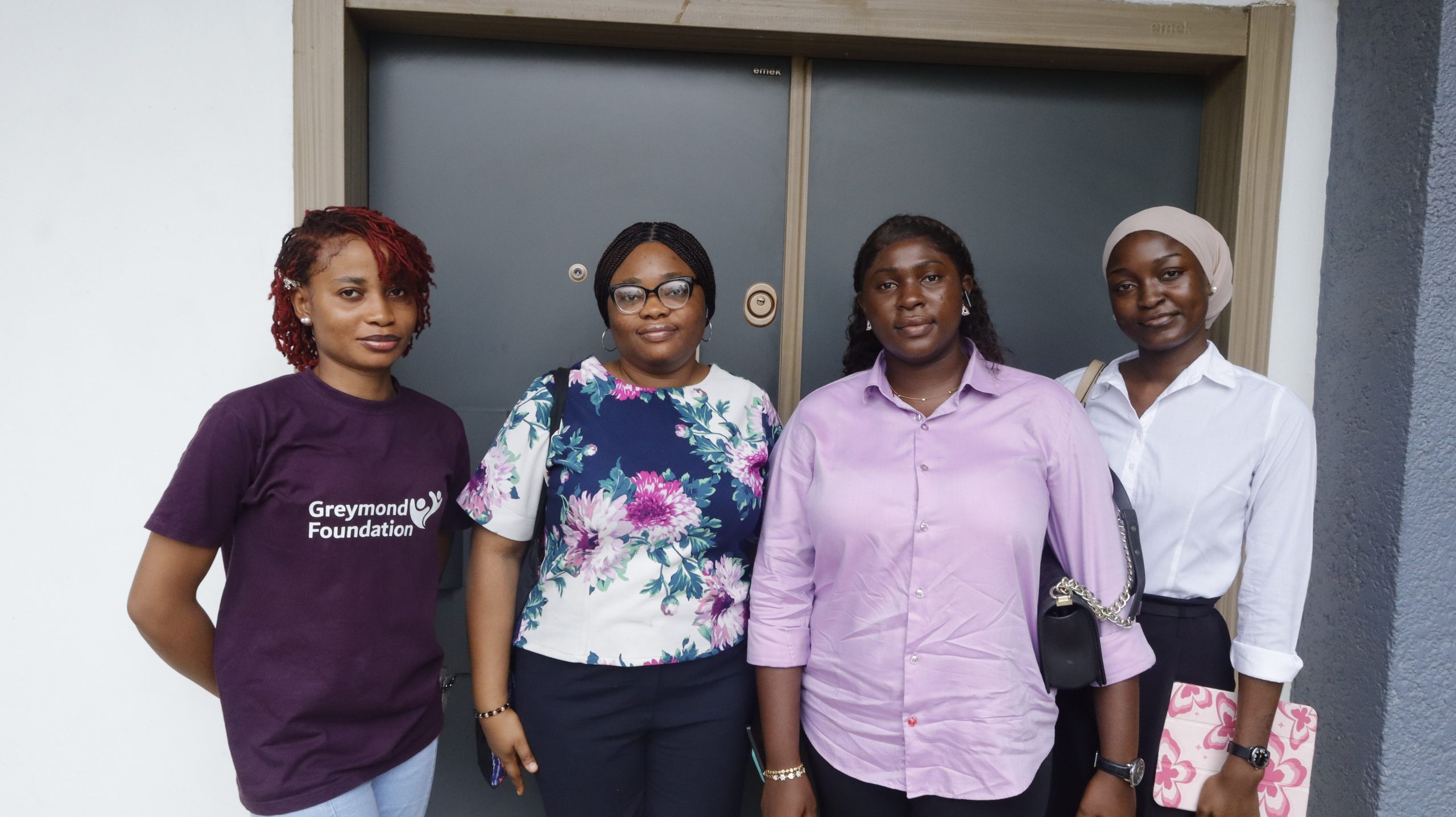 Greymond Women, Orphans and Charity Foundation staffs posing for a photograph
